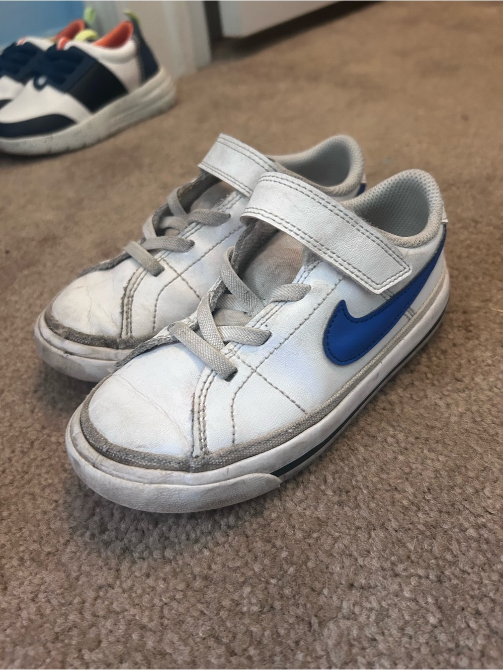Nike Kids White Sneakers with Blue Swoosh